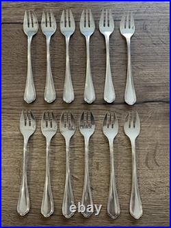 12 anciennes fourchettes à huitre en métal argenté Christofle modèle Spatour