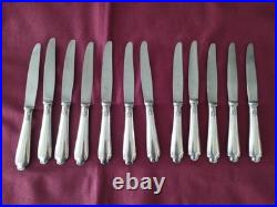 12 couteaux à entremet en métal argenté Christofle alfénide modèle pompadour
