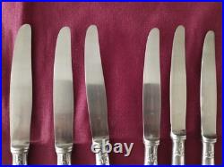 12 couteaux à entremet en métal argenté Christofle alfénide modèle pompadour