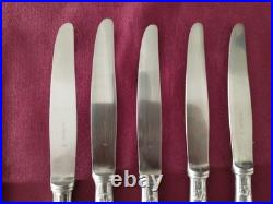 12 couteaux à entremet en métal argenté Christofle alfénide modèle pompadour
