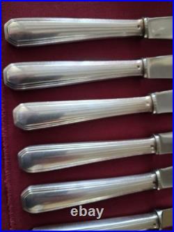 12 couteaux de table en métal argenté christofle modèle America