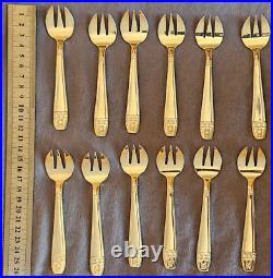 12 fourchettes à huitres en métal argenté modèle art déco Grand Prix