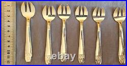 12 fourchettes à huitres en métal argenté modèle art déco Grand Prix