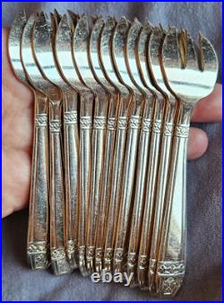 12 fourchettes à huitres en métal argenté modèle art déco Grand Prix