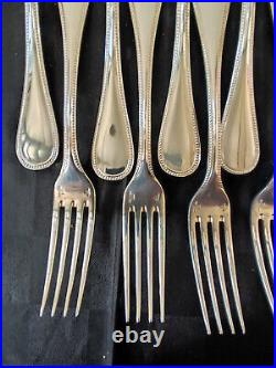 12 fourchettes de table en métal argenté Christofle modèle perles