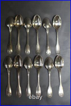 12 petites cuilléres en métal argenté Christofle modèle coquille