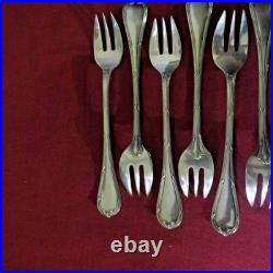 9 fourchettes à huitres en métal argenté modèle rubans 2