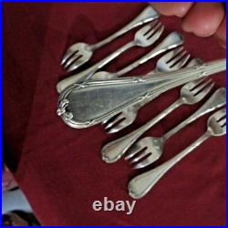 9 fourchettes à huitres en métal argenté modèle rubans 2