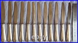 ALFENIDE / CHRISTOFLE 12 couteaux de table en métal argenté modèle POMPADOUR