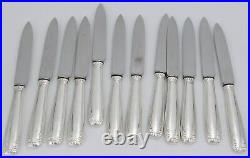Boulenger, 12 couteaux de table modèle Régence Berry, métal argenté