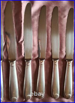 CHRISTOFLE 10 anciens couteaux de table métal argenté modèle coquille Vendôme