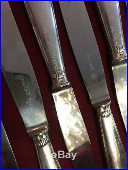 CHRISTOFLE 12 couteaux à entremets en métal argenté modèle coquille vendôme
