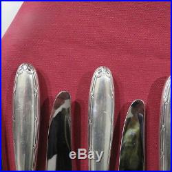 CHRISTOFLE 12 couteaux de table en métal argenté modèle ruban