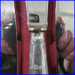 CHRISTOFLE 12 couteaux de table en métal argenté modèle ruban