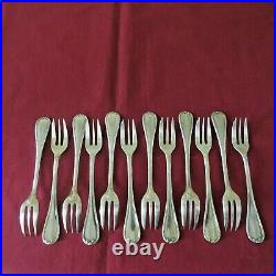CHRISTOFLE 12 fourchettes à gateaux en métal argenté modèle rubans