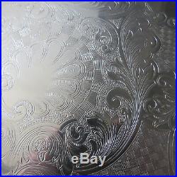 CHRISTOFLE fleuron grand plateau rond en métal argenté modèle gravé