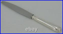 Cailar Bayard, 12 couteaux de table modèle Coquille, métal argenté