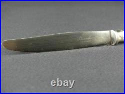 Christofle, 7 couteaux de table en métal argenté modèle rubans croisés