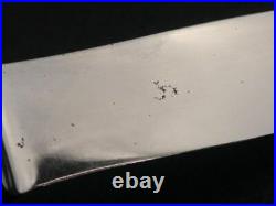 Christofle, 7 couteaux de table en métal argenté modèle rubans croisés