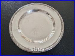Christofle Plat rond de service modèle Rubans croisés en métal argenté