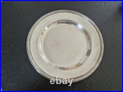 Christofle Plat rond de service modèle Rubans croisés en métal argenté