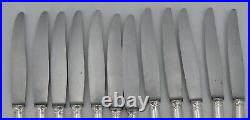 Christofle modèle Berain/Coquille, 12 couteaux de table, métal argenté