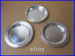 Christofle, trois dessous de bouteille en métal argenté 2 modèles Albi 1 Uniplat Christofle, trois dessous de bouteille en métal argenté 2 modèles Albi 1 Uniplat