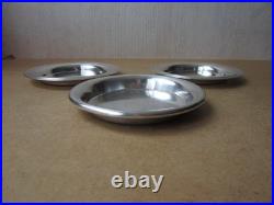 Christofle, trois dessous de bouteille en métal argenté 2 modèles Albi 1 Uniplat Christofle, trois dessous de bouteille en métal argenté 2 modèles Albi 1 Uniplat
