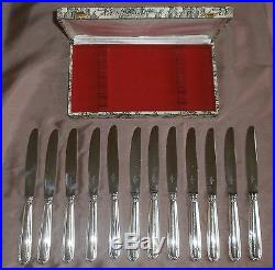 Coffret de 12 couteaux de table métal argenté modèle perles Ravinet D'Enfert