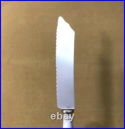 Couteau à pain CHRISTOFLE modèle RUBANS métal argenté Couvert de service 26 cm