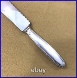 Couteau à pain CHRISTOFLE modèle RUBANS métal argenté Couvert de service 26 cm