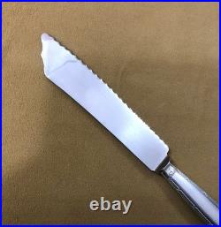 Couteau à pain CHRISTOFLE modèle RUBANS métal argenté Couvert de service 26 cm