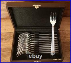 Douze fourchettes à dessert métal argenté Christofle Modèle Aria bicolore