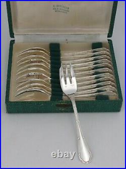 Ercuis modèle Trianon/Rubans/Louis XVI, 12 fourchettes à gâteaux métal argenté