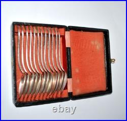 Lot 12 cuillères à dessert en métal argenté APOLLO modèle Rocaille