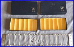 Orfèvrerie ERCUIS 12 porte couteaux en métal argenté modèle Croix & boules