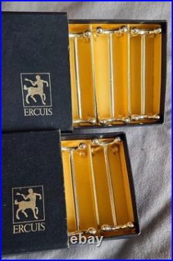 Orfèvrerie ERCUIS 12 porte couteaux en métal argenté modèle Croix & boules Orfèvrerie ERCUIS 12 porte couteaux en métal argenté modèle Croix & boules