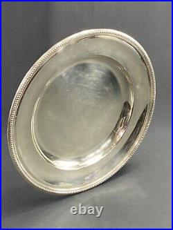 Plat circulaire en métal argenté signé Christofle modèle perles