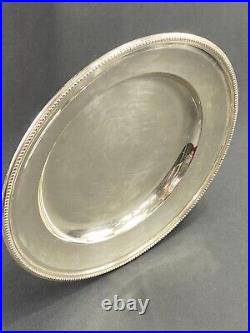 Plat circulaire en métal argenté signé Christofle modèle perles