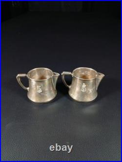 Pots à lait Christofle métal argenté gravés licorne et ancre, modèle institution