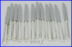Ravinet d'Enfert modèle demi-coquille, 12 couteaux de table en excellent état